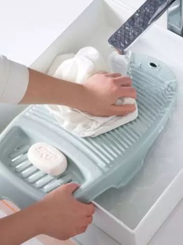 Scrub the Clothes Using Your Washboard
