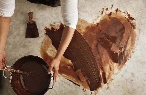 Scrape off the excess to Remove Chocolate Stains from Clothes